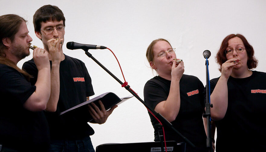 Barbership at DFDF 2010, playing kazoos on stage. We are wearing matching t-shirts with our logo.